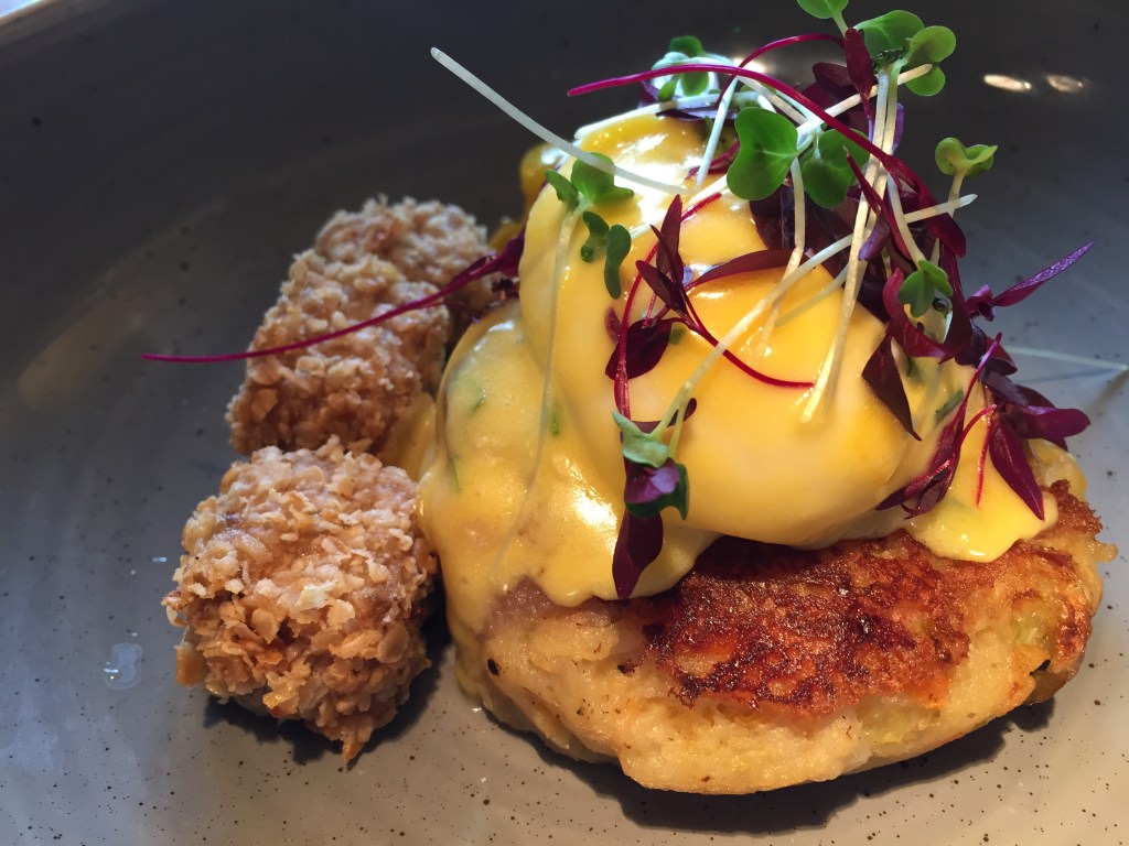 Bubble and squeak with homemade spam fritters, poached egg & piccalilli